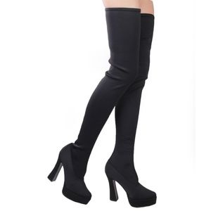 Thigh high black stretch BDSM boots.